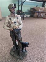 Hunter and dog statue