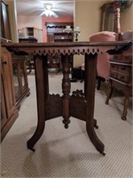 Antique Eastlake style table on wheels missing