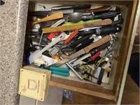 Drawer contents can openers, knives, utensils