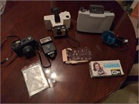 Vintage Polaroid and Bentley cameras, flashes,