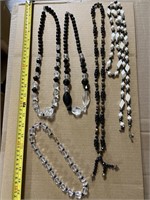5 black with white or clear beads,  beaded