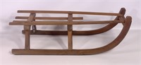 Wooden sled, bent wood runners have metal
