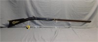 Antique black powder rifle with brass details.