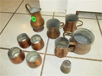 Small brass/copper looking cups and pitchers
