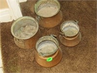 4 copper looking pots