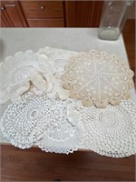 Six vintage large doilies