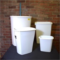 4 white plastic trash cans