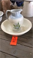Floral ceramic pitcher in ironstone bowl, bowl