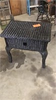 Black painted wicker side table