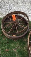 2 small iron wheels approx 2’ wheels
