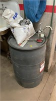 55 gallon barrel with pump (contents unknown),