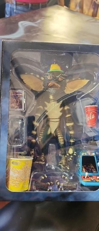 Electronic Piggy Bank and Gremlins Collectible