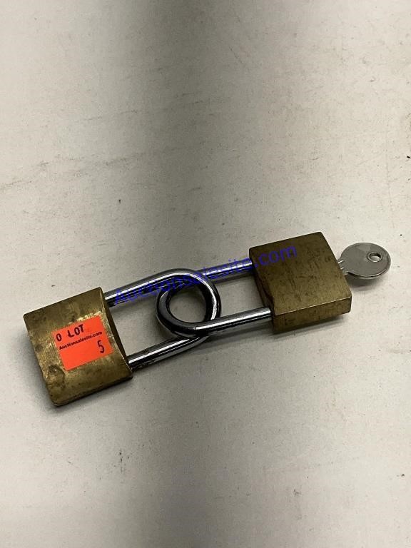 Two brass padlocks with key
