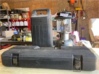 Kerosene lantern and empty toolbox.