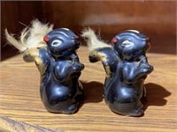 2 Skunk Figurines