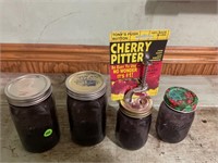 LOT OF 4 PURPLE BALL JARS WITH CHERRY PITTER