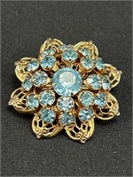 Vintage pin. Blue rhinestones with goldtone accent