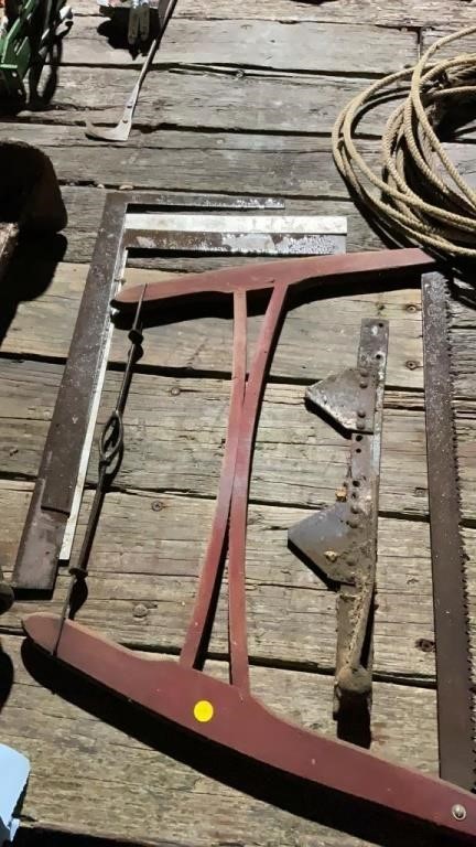 Antique saw, sickle section, carpenter squares