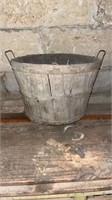 Wood bucket with vintage glass jars and bottles