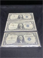 Three 1957 $1 Silver Certificate