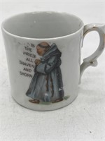 Antique child’s cup is the priest, all shaven and