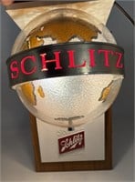 Schlitz Globe motion light. Couple cracks on