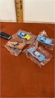 4 New sealed in pkg  Hotwheels and 1 loose Hot