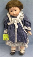 Porcelain doll in fancy blue dress