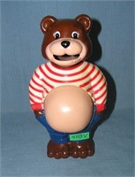Pot belly bear bank add coins and watch his belly