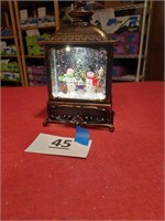 Lighted snow globe with pump of air