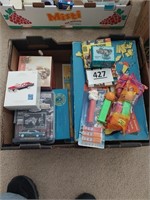 Lot of assorted puzzles, toy cars and Pez