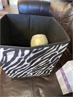 Small fabric zebra striped basket filled with