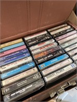 3 storage cases filled with cassette tapes