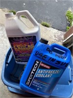 Red and blue tote both filled with antifreeze,