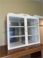 Mirror back display cabinet can be hung on the