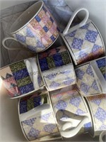 Six cups and plates to match in fabric storage