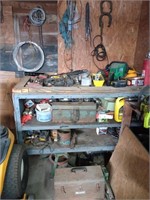 Small bench full of tools and stuff