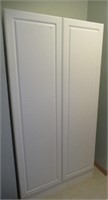 White 2 door cabinet. Measures: 71" H x 36" W x