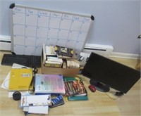 Various office items including keyboard, monitor,