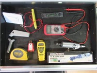 Contents of drawer that includes laser tape,