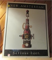 Tin New Amsterdam sign. Measures: 20" H x 16" W.