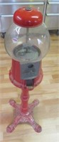 Gumball machine on stand.