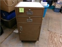 Heavy steel cabinet on wheels with contents
