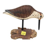 Carved wooden shorebird, marked JG