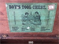 Wooden child's tool box with paper label inside on