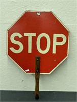 Early STOP sign on wooden handle