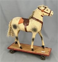 Early horse on wheels pull toy