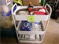 Rolling metal cart with contents