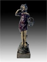 BRONZE SCULPTURE OF A YOUNG GIRL WITH BASKET