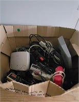 Box of misc games and cords